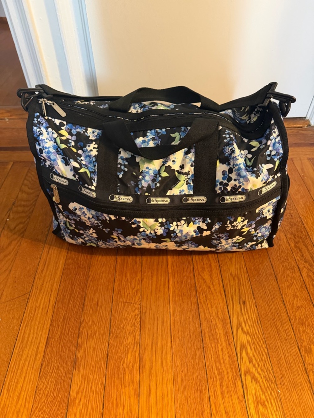 Lesportsac Black Floral Travel Weekender with Blue Accents
